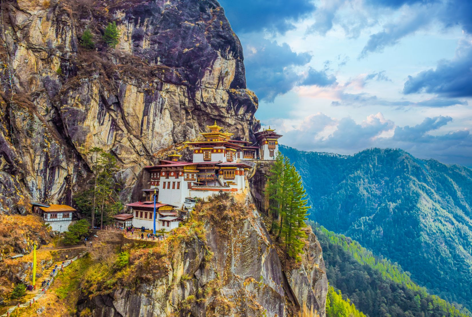 Tiger’s Nest Monastery (Paro Taktsang) on a cliff above Paro Valley, Bhutan
Punakha Dzong at the confluence of Pho Chhu and Mo Chhu rivers, springtime jacaranda blooms
Buddha Dordenma statue overlooking Thimphu Valley at sunset
Dochula Pass 108 Druk Wangyal Chortens with Himalayan mountain views
Tashichho Dzong illuminated at dusk in Thimphu, Bhutan
Phobjikha Valley panoramic landscape with traditional farmhouses
Black?necked cranes in Phobjikha Valley during winter migration
Paro Rinpung Dzong and traditional wooden bridge over Paro Chhu
Prayer flags fluttering on a hillside trail with Himalayan backdrop in Bhutan
Punakha Suspension Bridge with colorful prayer flags across the river
Local Bhutanese masks and costumes during a tsechu festival dance
Traditional Bhutanese farmhouse courtyard and terraced fields
Hand?woven textiles at a craft market in Thimphu, Bhutan
Haa Valley alpine scenery and quiet village road
Sunrise light over Paro town and surrounding mountains
