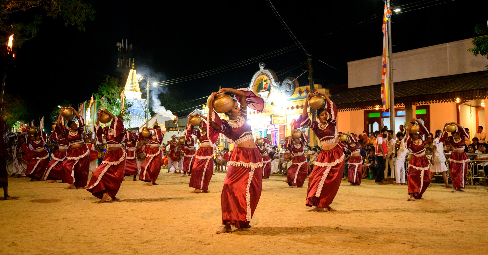 Female pot dancers performing at the Kataragama festival in Sri Lanka, dressed in colorful traditional attire. These cultural performances highlight ancient rituals, devotion, and the island’s vibrant Hindu and Buddhist heritage.